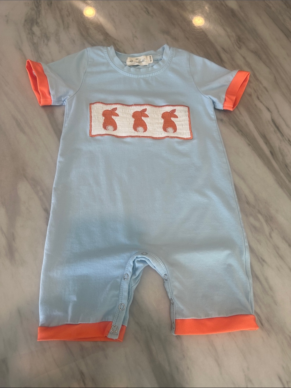 Light Blue Baby One-Piece with Orange Trim and Bunny Motif